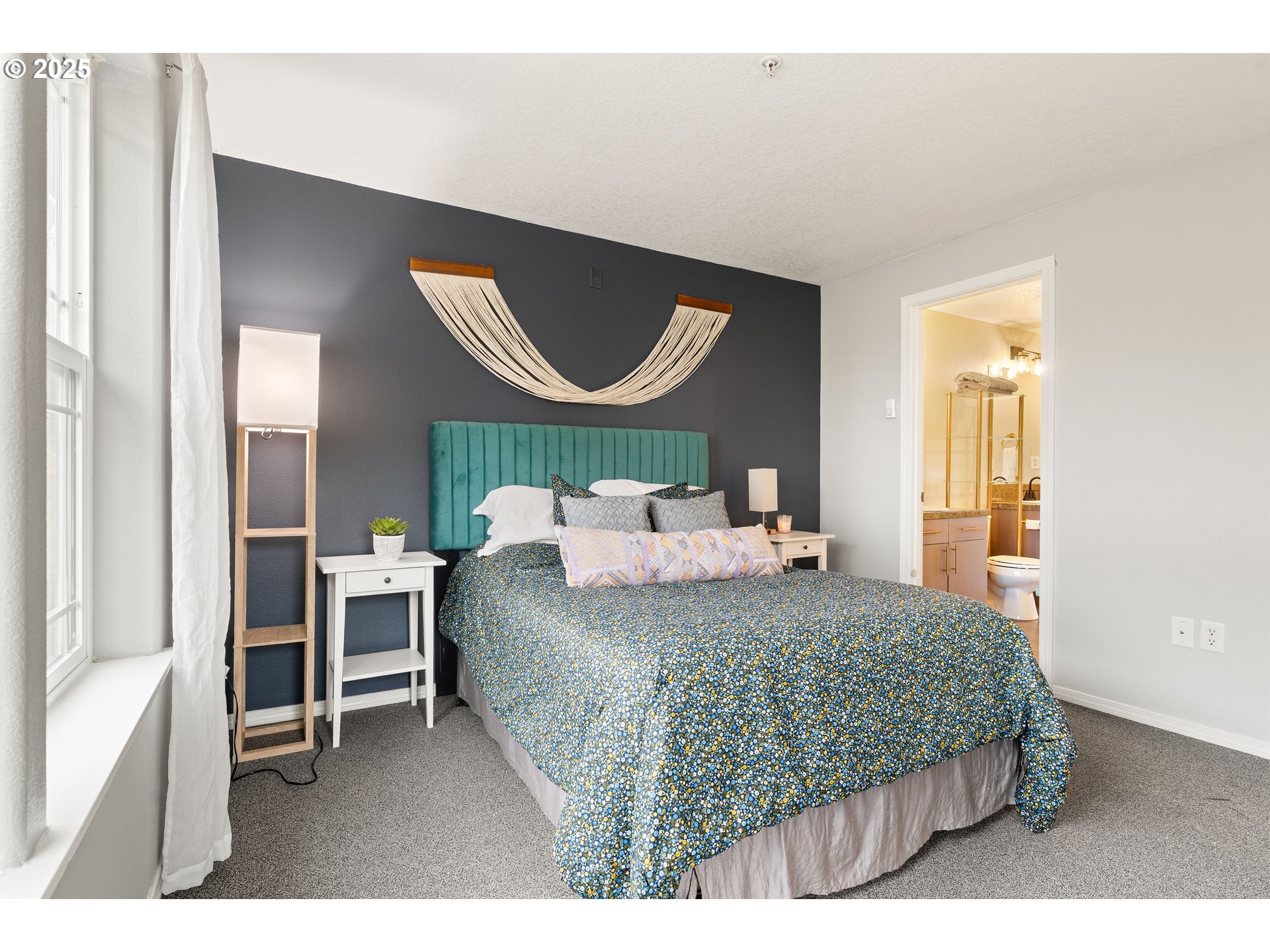 6700 North Pittsburg Avenue Portland, OR 97203 - Photo 18 of 29 a bedroom with a bed a mirror and a window