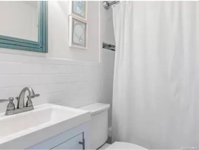 a bathroom with a sink and a toilet