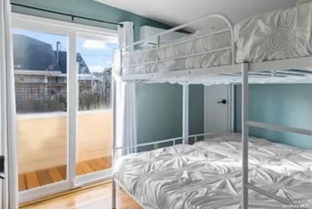 a bedroom with a bed and a mirror