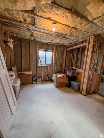 680 Timpie Road Tooele, UT 84074 - Photo 28 of 31 Unfinished interior space featuring exposed wood framing, ceiling insulation, and a concrete floor