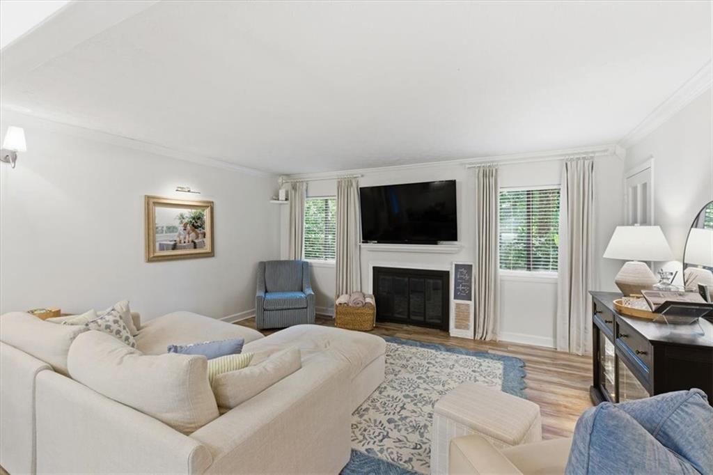 2907 Ironwood Road Southeast Marietta, GA 30067 - Photo 13 of 41 a living room with furniture a fireplace and a flat screen tv