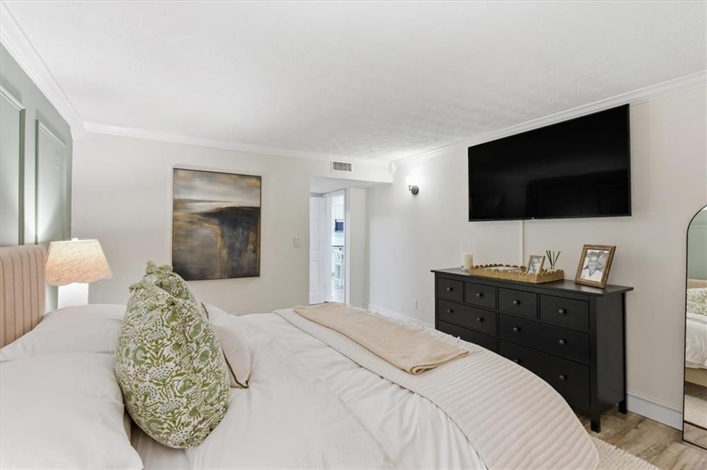 2907 Ironwood Road Southeast Marietta, GA 30067 - Photo 18 of 41 a bedroom with a large bed and a flat screen tv