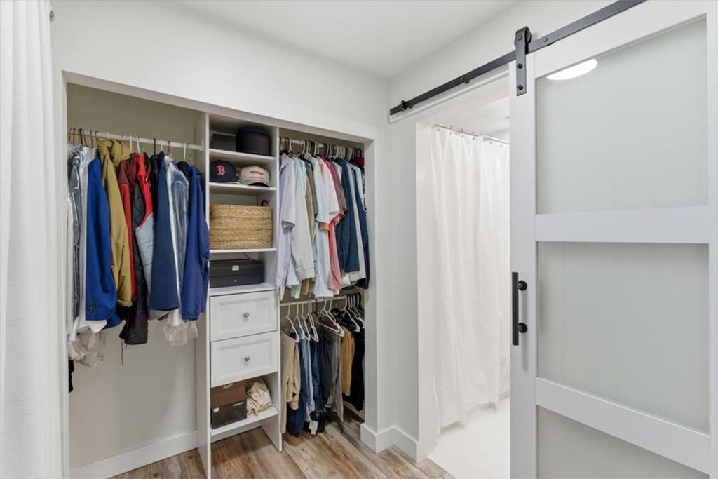 2907 Ironwood Road Southeast Marietta, GA 30067 - Photo 20 of 41 a view of walk in closet with clothes