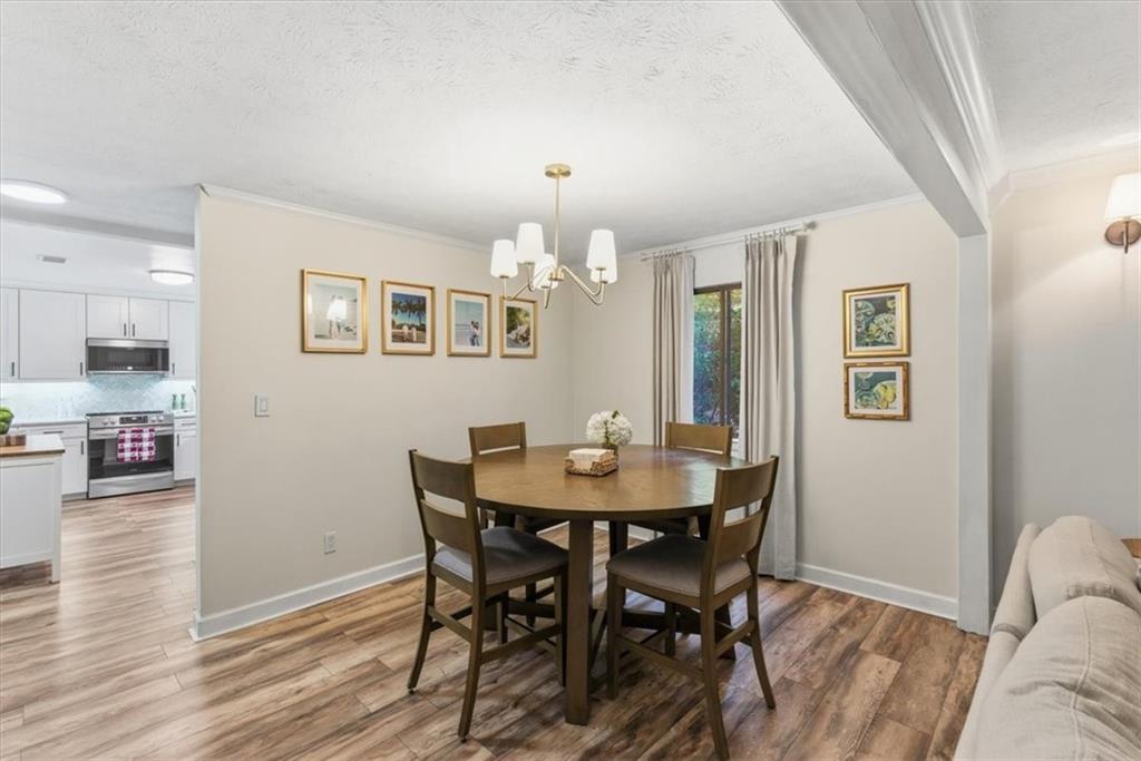 2907 Ironwood Road Southeast Marietta, GA 30067 - Photo 10 of 41 a view of a dining room with furniture and wooden floor