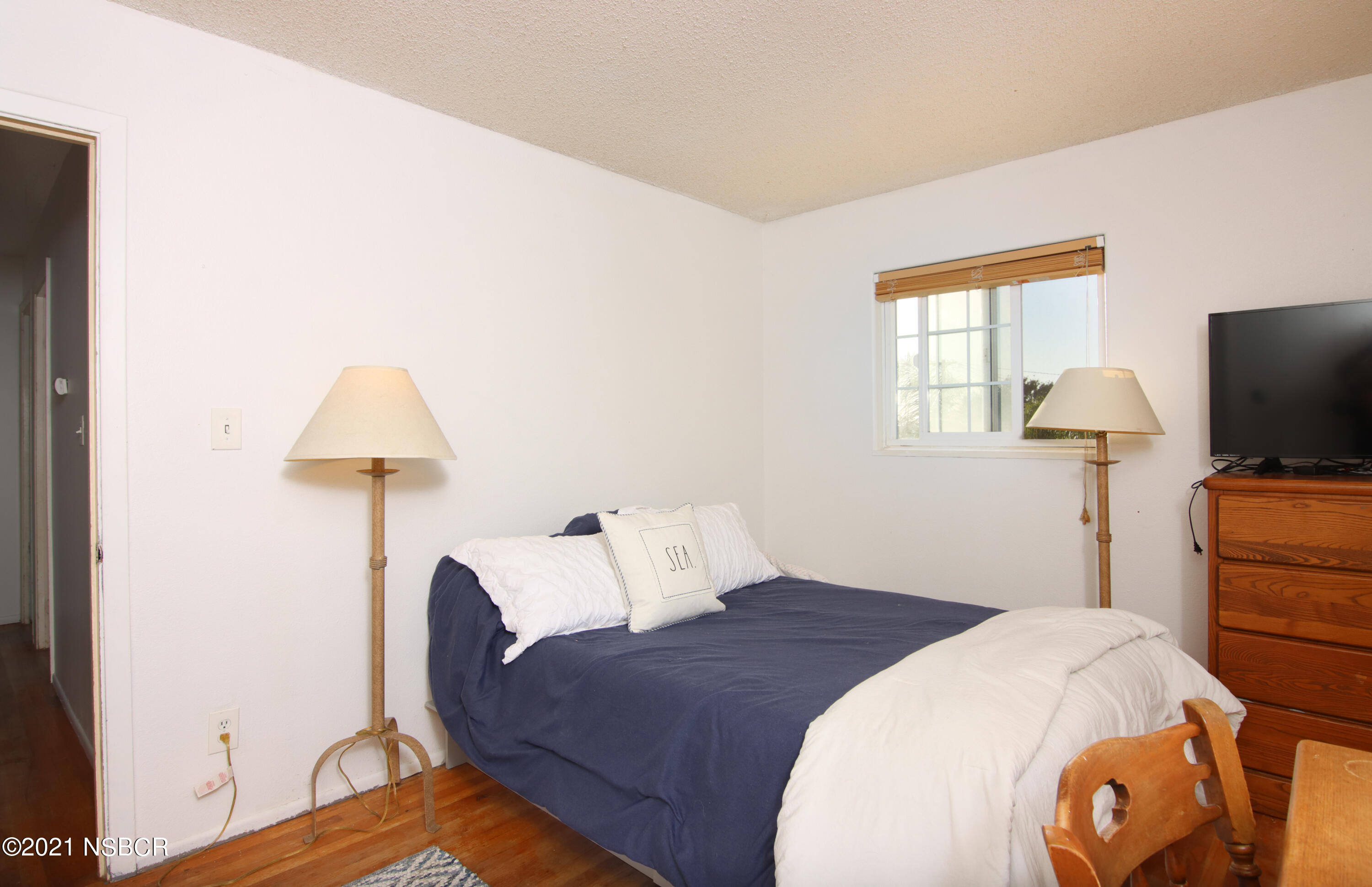 492 Milky Way Lompoc, CA 93436 - Photo 15 of 27 a bedroom with a bed and a flat screen tv