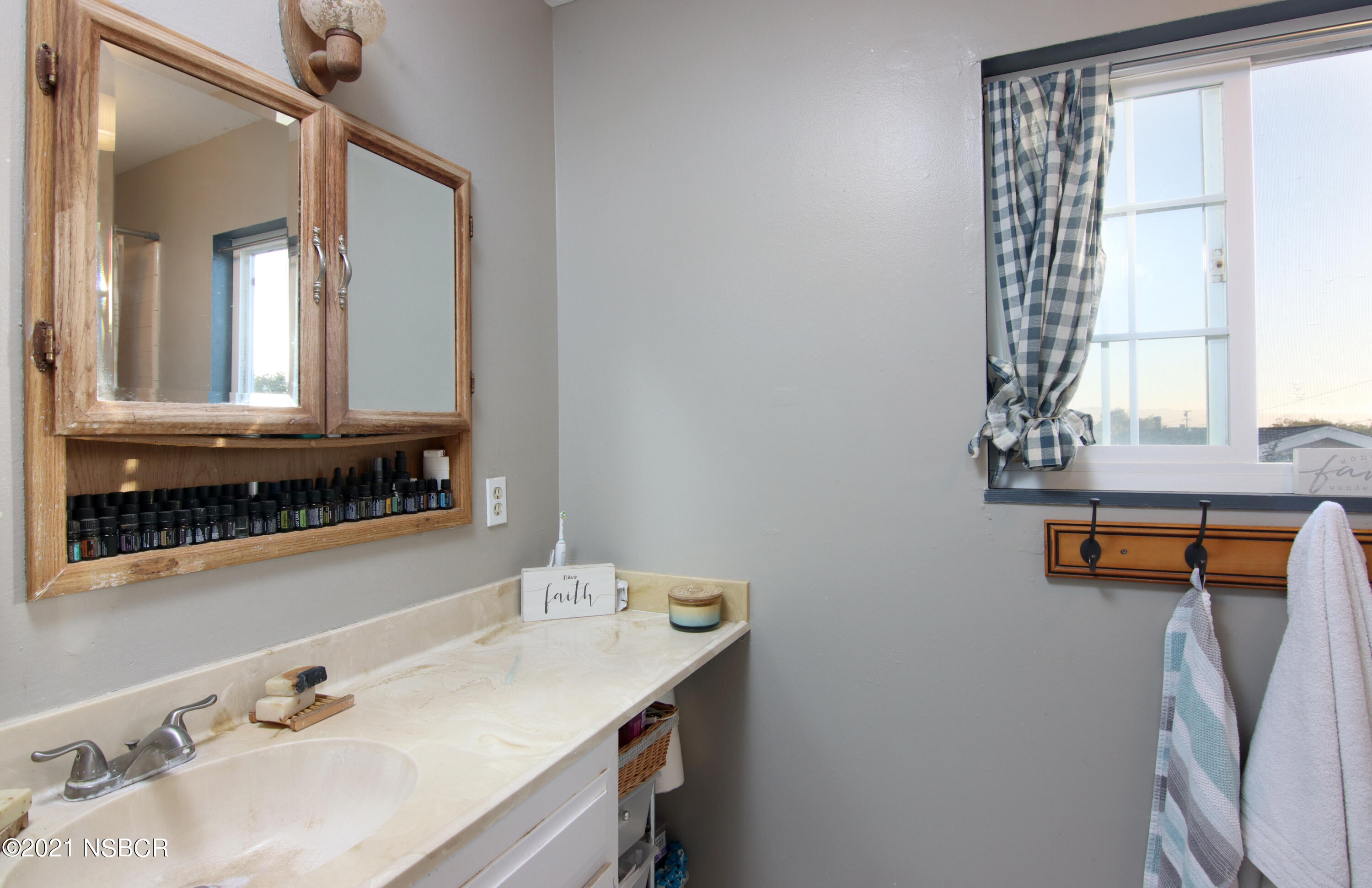 492 Milky Way Lompoc, CA 93436 - Photo 18 of 27 a bathroom with a sink and a mirror