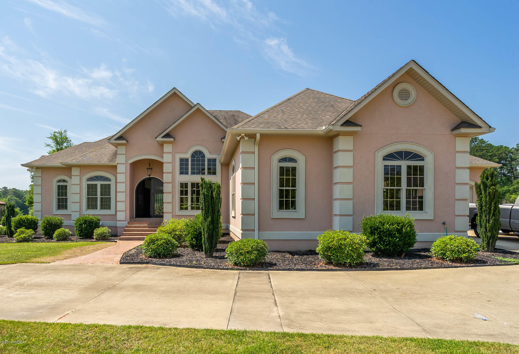 a front view of a house with a yard