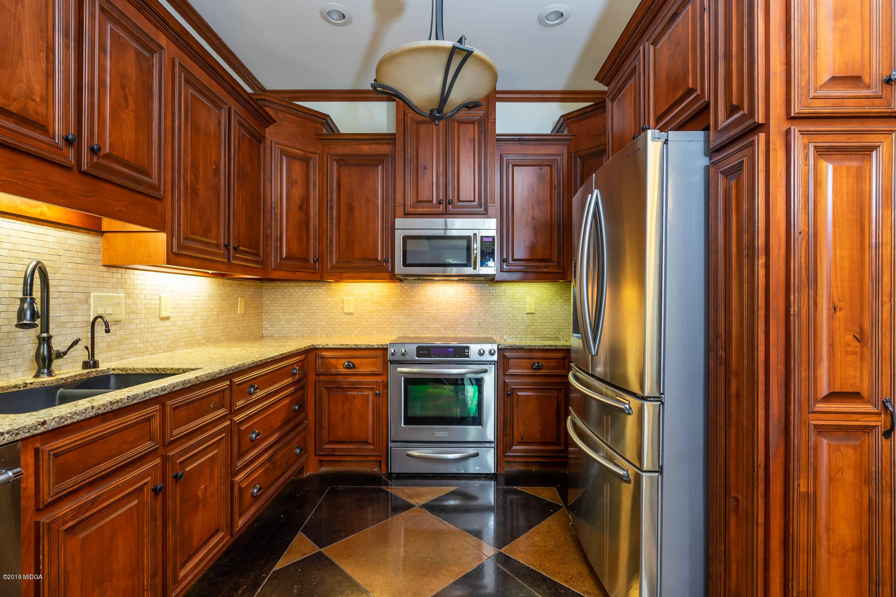 6331 Dobson Road Macon, GA 31220 - Photo 12 of 26 a kitchen with stainless steel appliances granite countertop a refrigerator and a sink