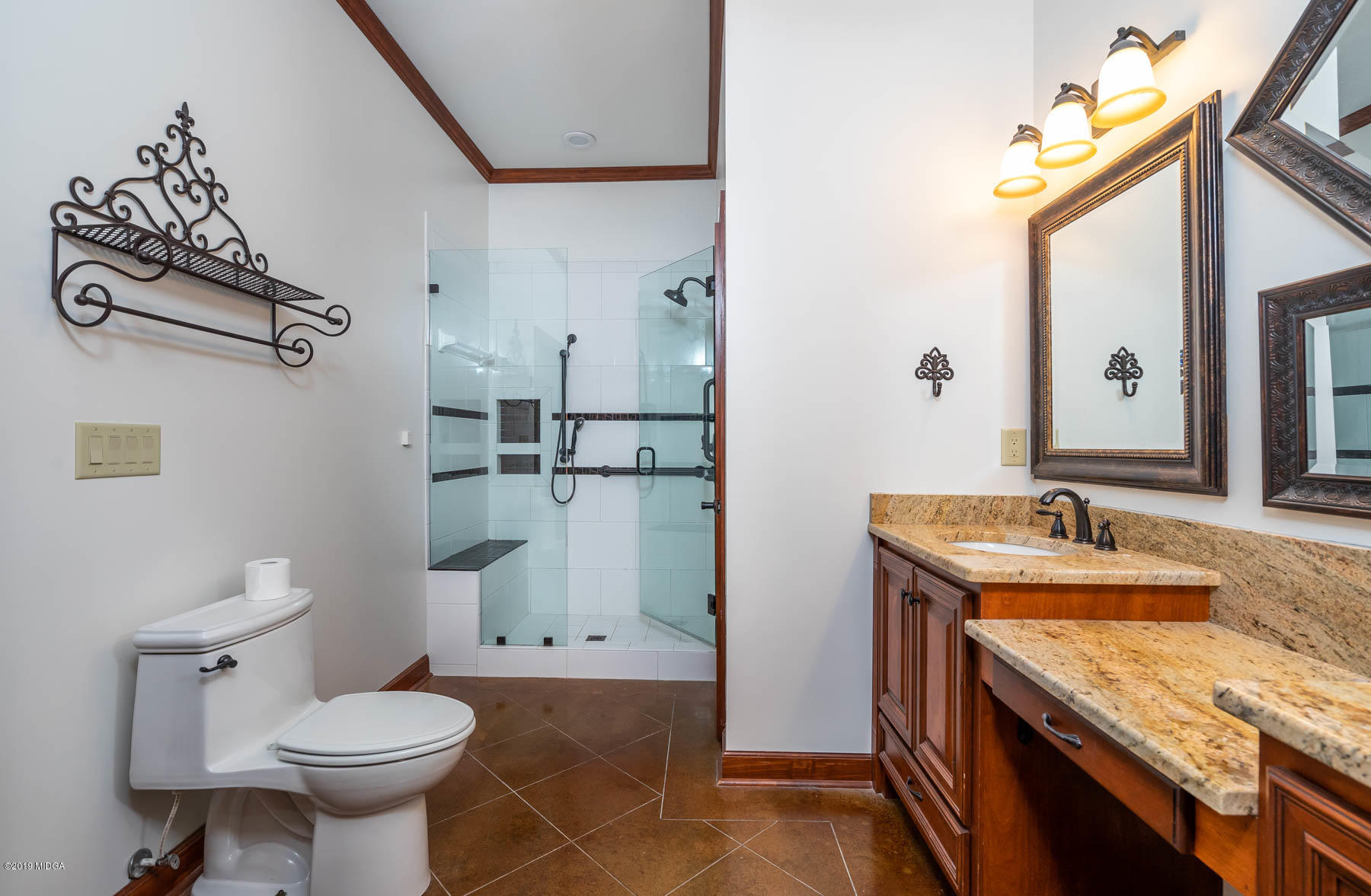 6331 Dobson Road Macon, GA 31220 - Photo 21 of 26 a bathroom with a granite countertop toilet sink and mirror