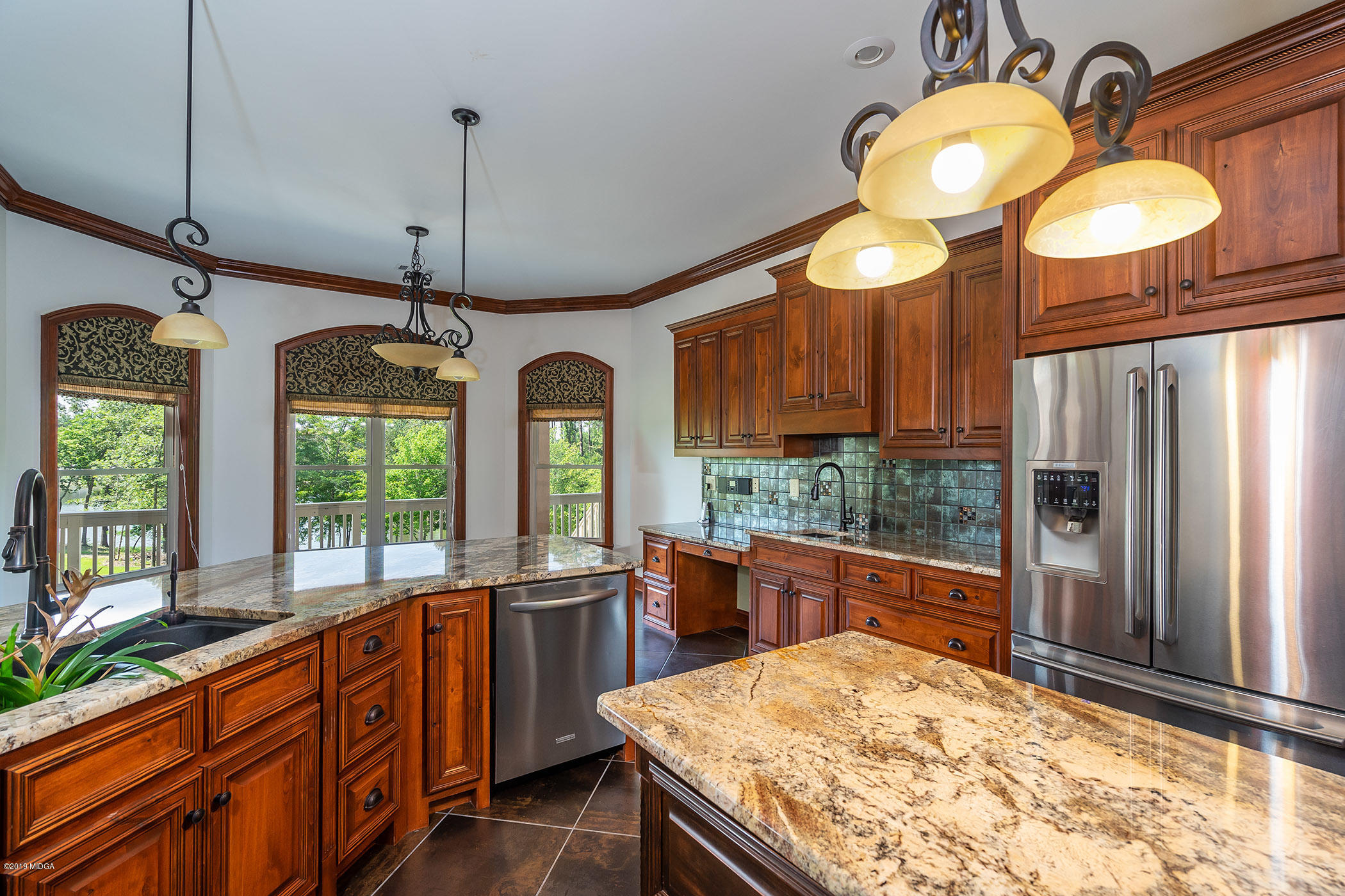 6331 Dobson Road Macon, GA 31220 - Photo 23 of 26 a kitchen with stainless steel appliances granite countertop a stove a refrigerator and a wooden cabinets