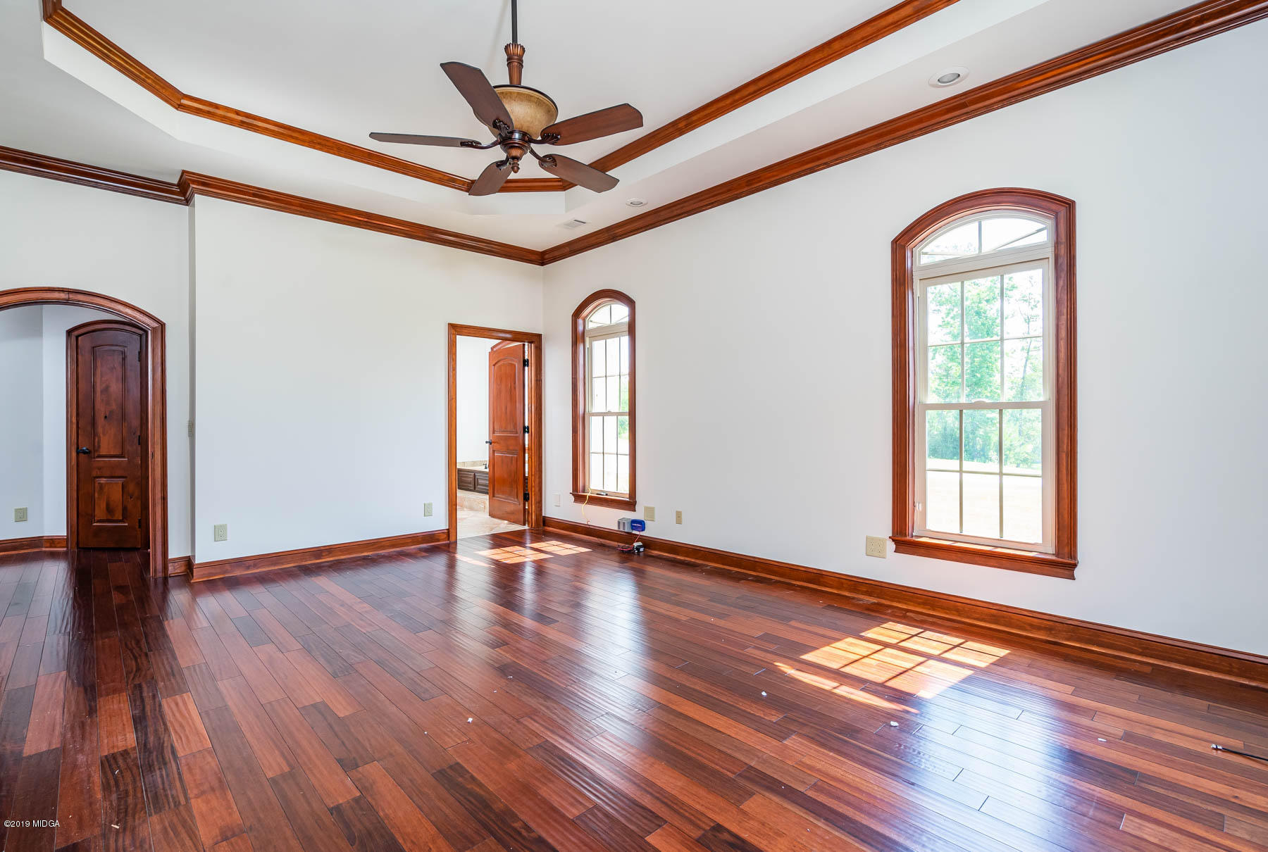6331 Dobson Road Macon, GA 31220 - Photo 7 of 26 a view of an empty room with wooden floor and a window