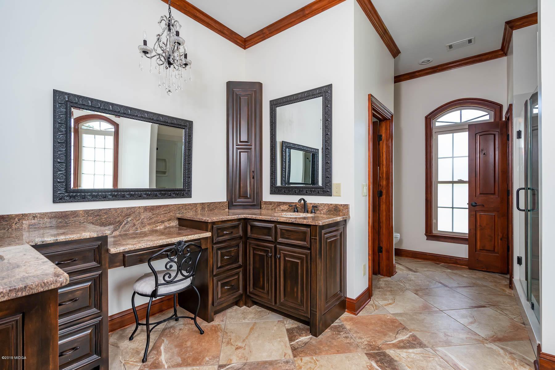 6331 Dobson Road Macon, GA 31220 - Photo 8 of 26 a spacious bathroom with a granite countertop sink and a mirror