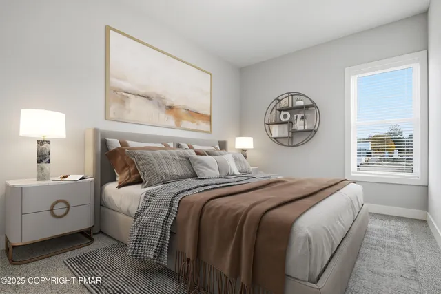 a bedroom with a large bed and a window