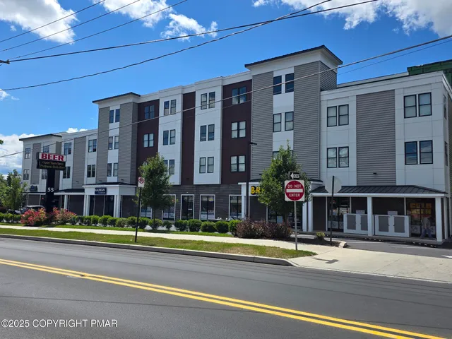 a view of a building with a street