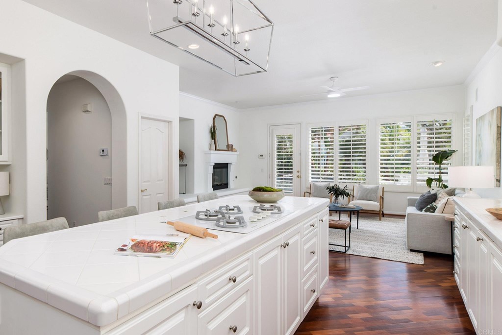 1368 Corvidae Street Carlsbad, CA 92011 - Photo 12 of 38 a spacious bedroom with furniture and a chandelier
