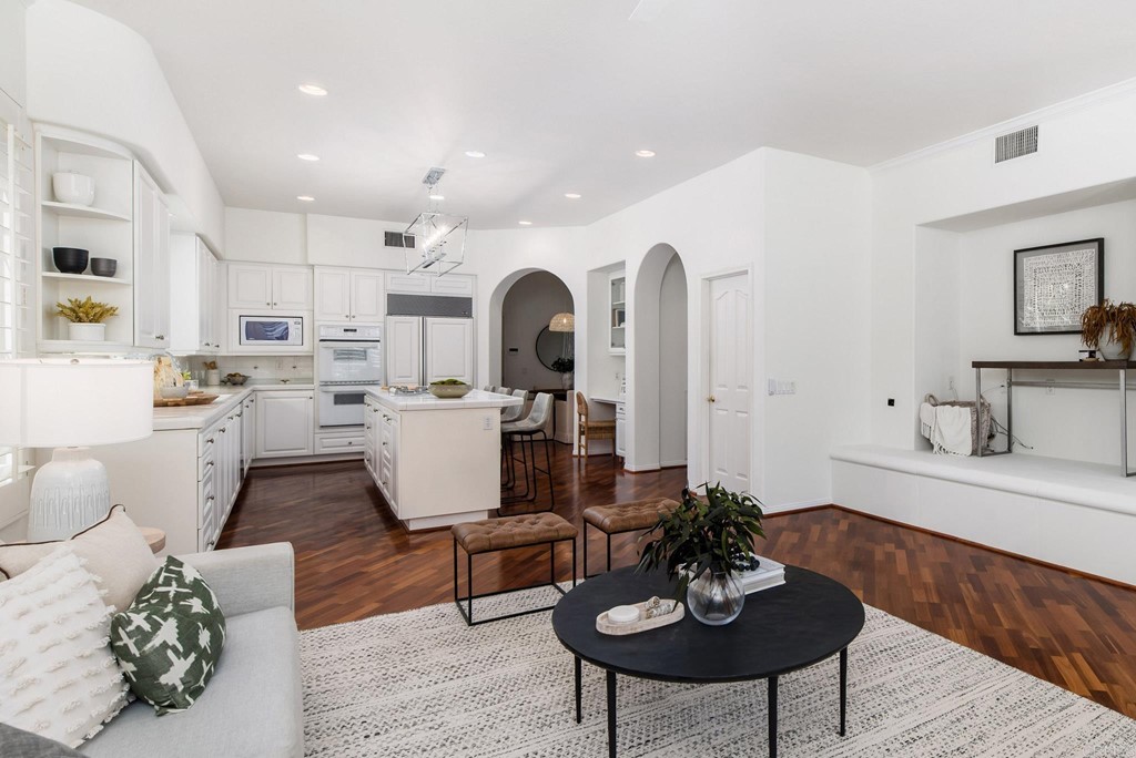 1368 Corvidae Street Carlsbad, CA 92011 - Photo 16 of 38 a living room with kitchen and a couch