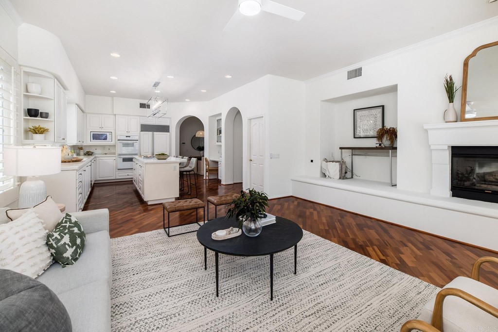 1368 Corvidae Street Carlsbad, CA 92011 - Photo 17 of 38 a living room with furniture and a fireplace