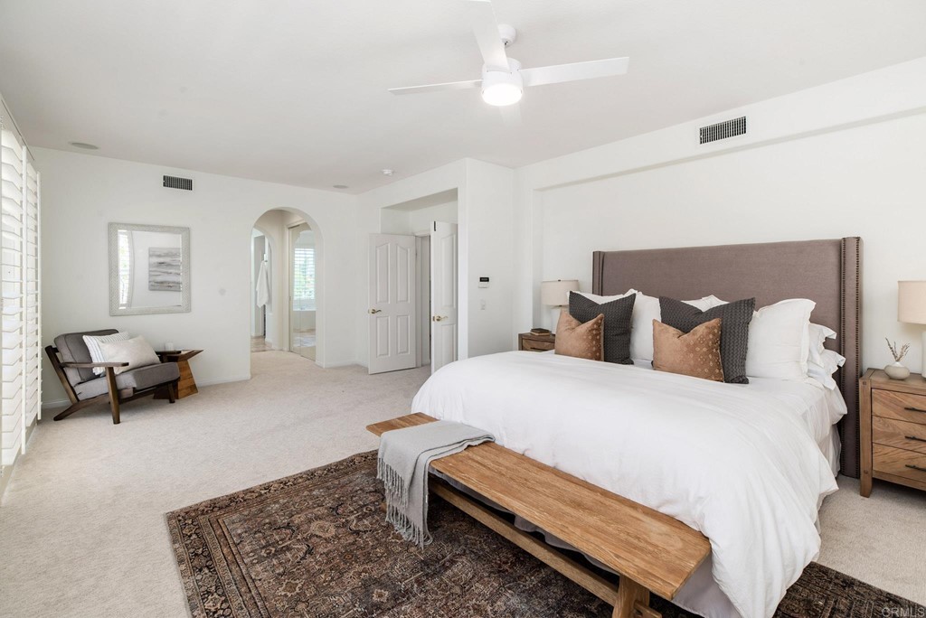 1368 Corvidae Street Carlsbad, CA 92011 - Photo 21 of 38 a bedroom with bed and window