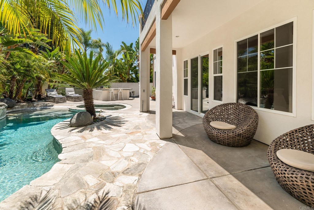 1368 Corvidae Street Carlsbad, CA 92011 - Photo 29 of 38 a view of a backyard with furniture and floor to ceiling window