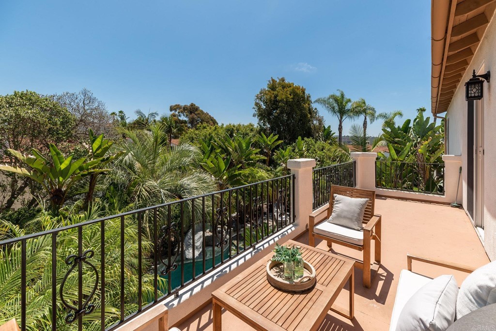 1368 Corvidae Street Carlsbad, CA 92011 - Photo 35 of 38 a view of a balcony with chairs and wooden floor