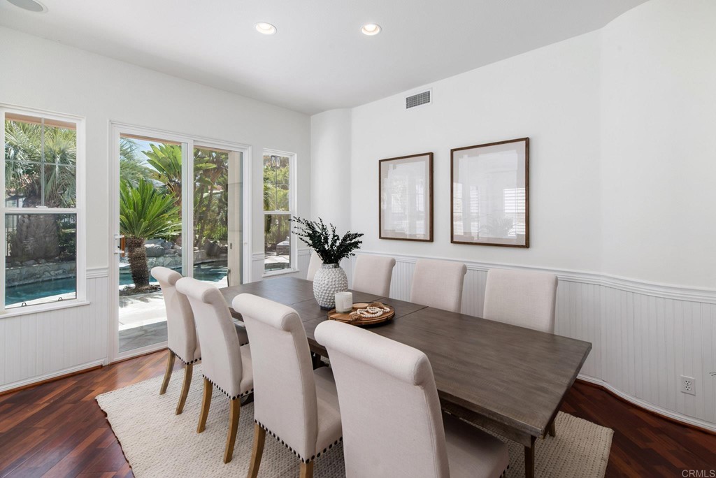 1368 Corvidae Street Carlsbad, CA 92011 - Photo 5 of 38 a dining room with furniture and wooden floor