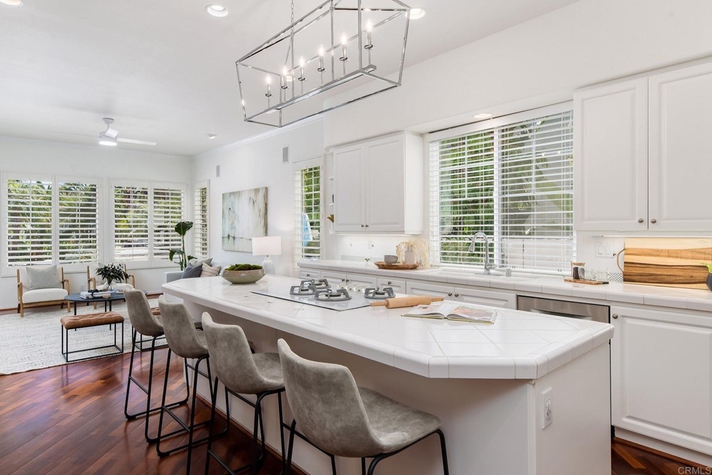1368 Corvidae Street Carlsbad, CA 92011 - Photo 9 of 38 a view of a dining room with furniture window and wooden floor