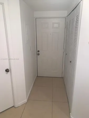 a view of hallway with white doors
