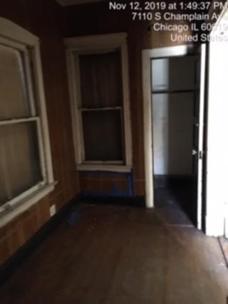 7110 South Champlain Avenue Chicago, IL 60619 - Photo 4 of 13 a view of empty room with front door
