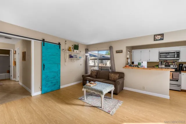 a living room with furniture and a window