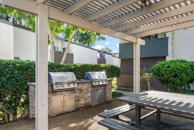 a outdoor living space with patio furniture and potted plants