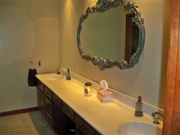 284 Mountain Road Gill, MA 01354 - Photo 13 of 28 a bathroom with a granite countertop sink and a mirror