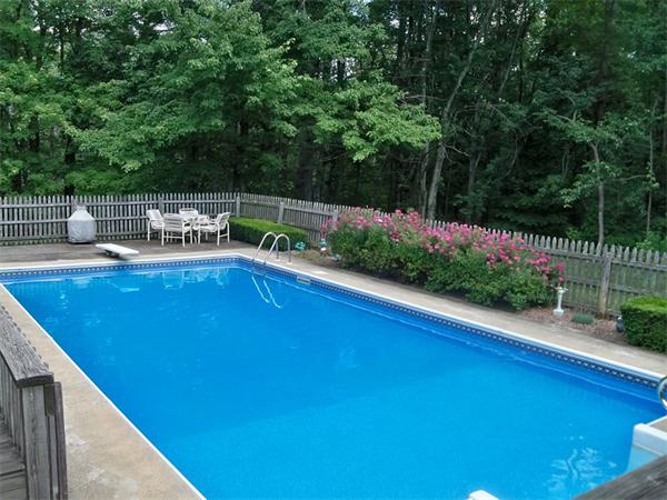 284 Mountain Road Gill, MA 01354 - Photo 25 of 28 a view of a swimming pool with a patio and garden