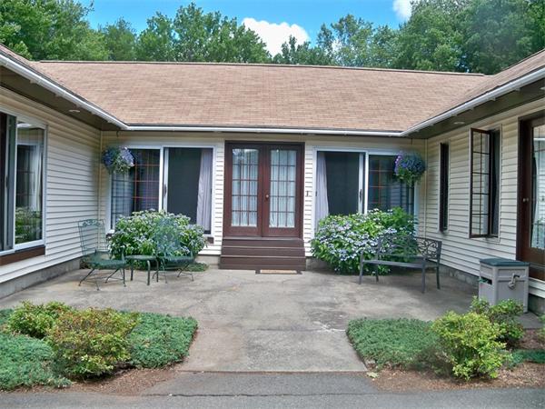 284 Mountain Road Gill, MA 01354 - Photo 3 of 28 a front view of a house with a garden