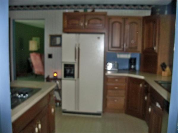 284 Mountain Road Gill, MA 01354 - Photo 8 of 28 a kitchen with a refrigerator and a sink