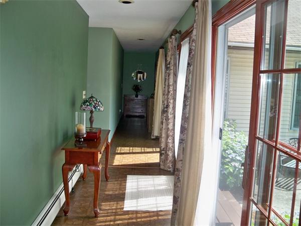284 Mountain Road Gill, MA 01354 - Photo 10 of 28 a view of an entryway with wooden floor and a fireplace