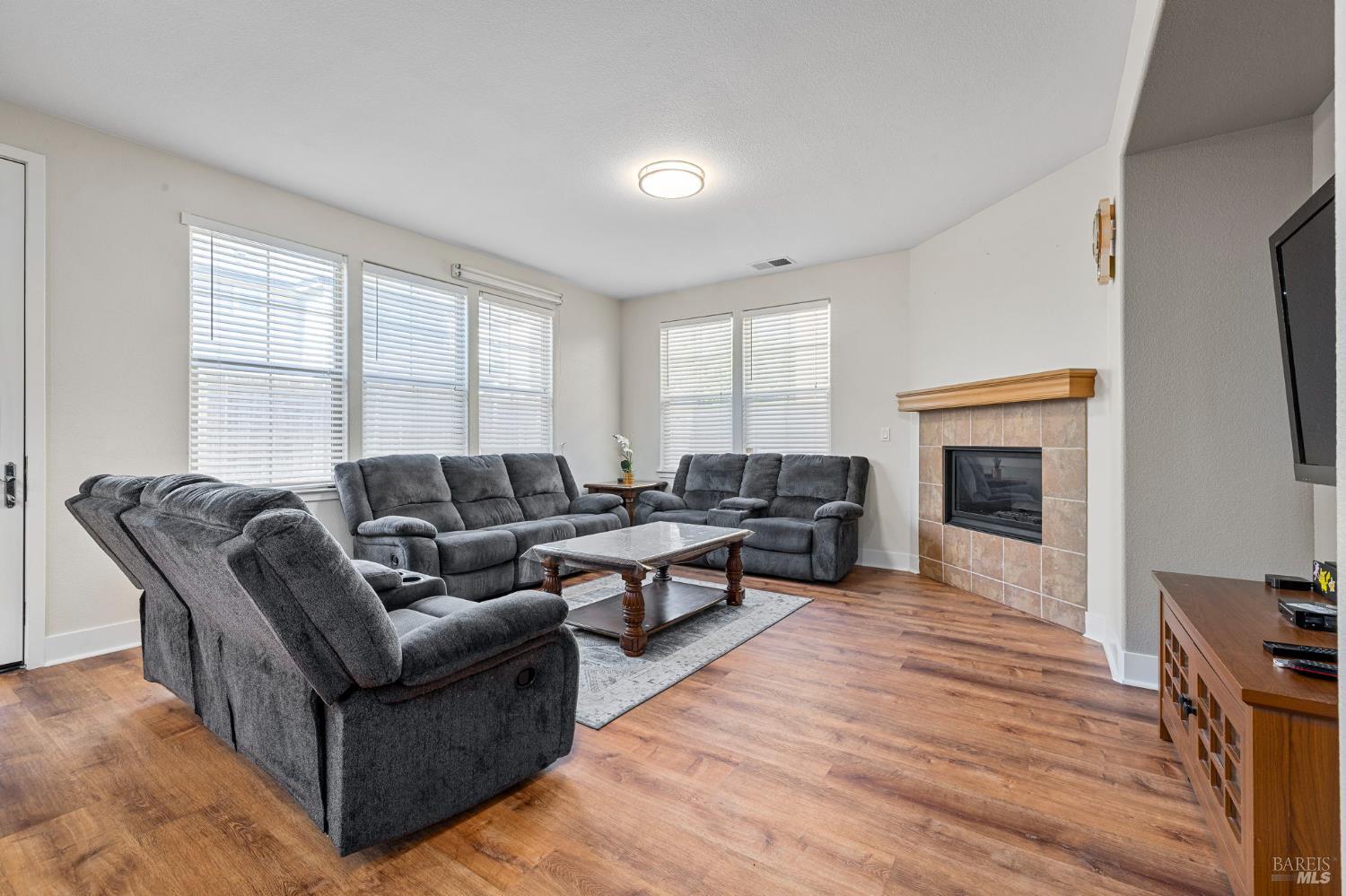 1461-1463 Trombetta Street Santa Rosa, CA 95407 - Photo 14 of 53 a living room with furniture and a fireplace
