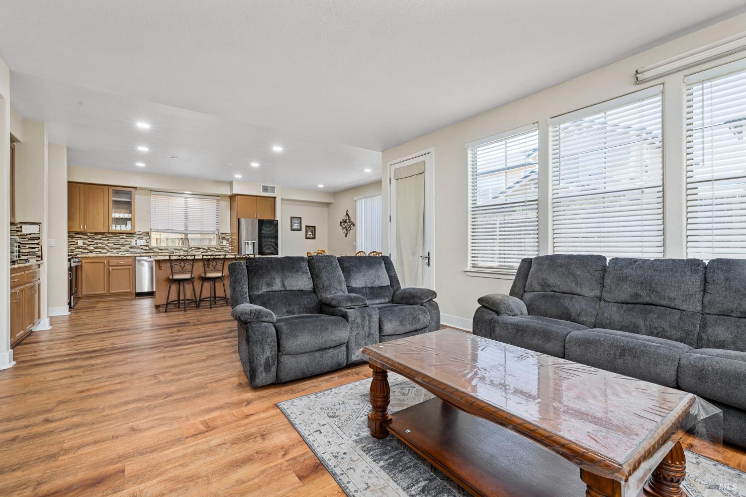 1461-1463 Trombetta Street Santa Rosa, CA 95407 - Photo 16 of 53 a living room with furniture and a wooden floor