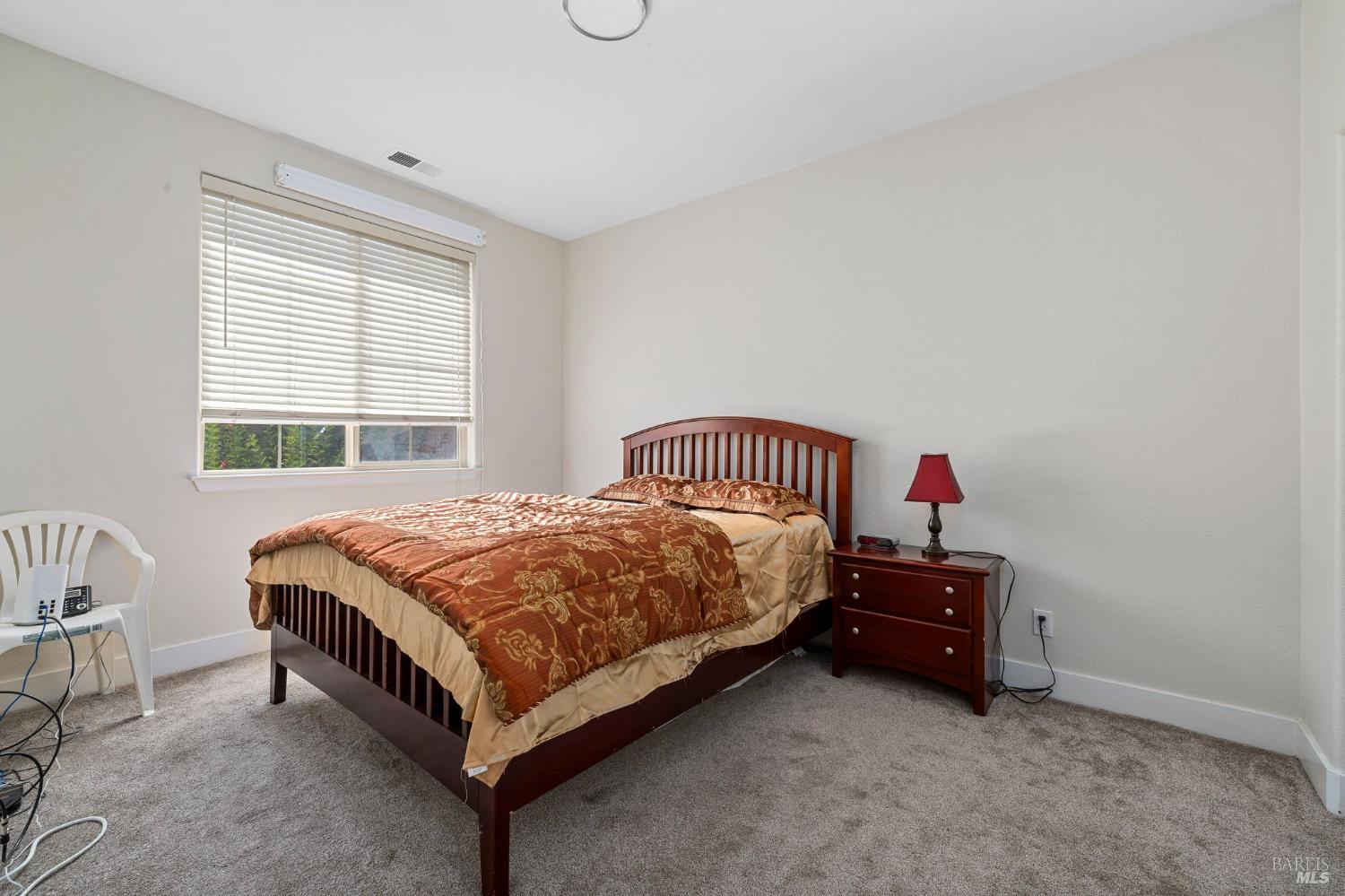 1461-1463 Trombetta Street Santa Rosa, CA 95407 - Photo 26 of 53 a spacious bedroom with a bed and a window