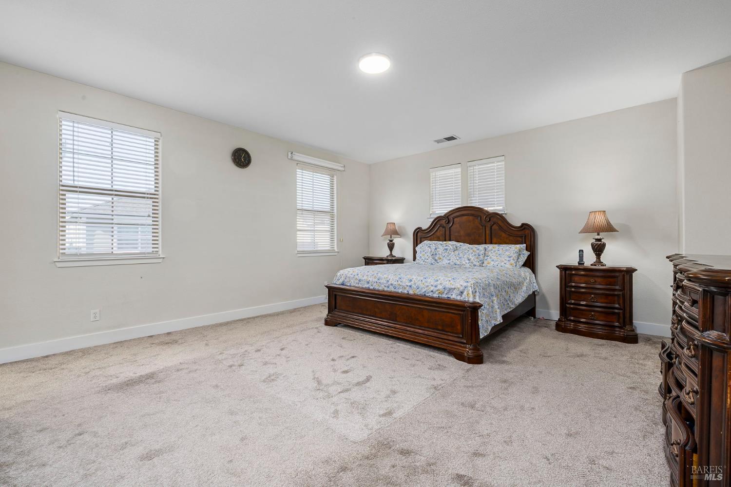 1461-1463 Trombetta Street Santa Rosa, CA 95407 - Photo 30 of 53 a spacious bedroom with a bed and window