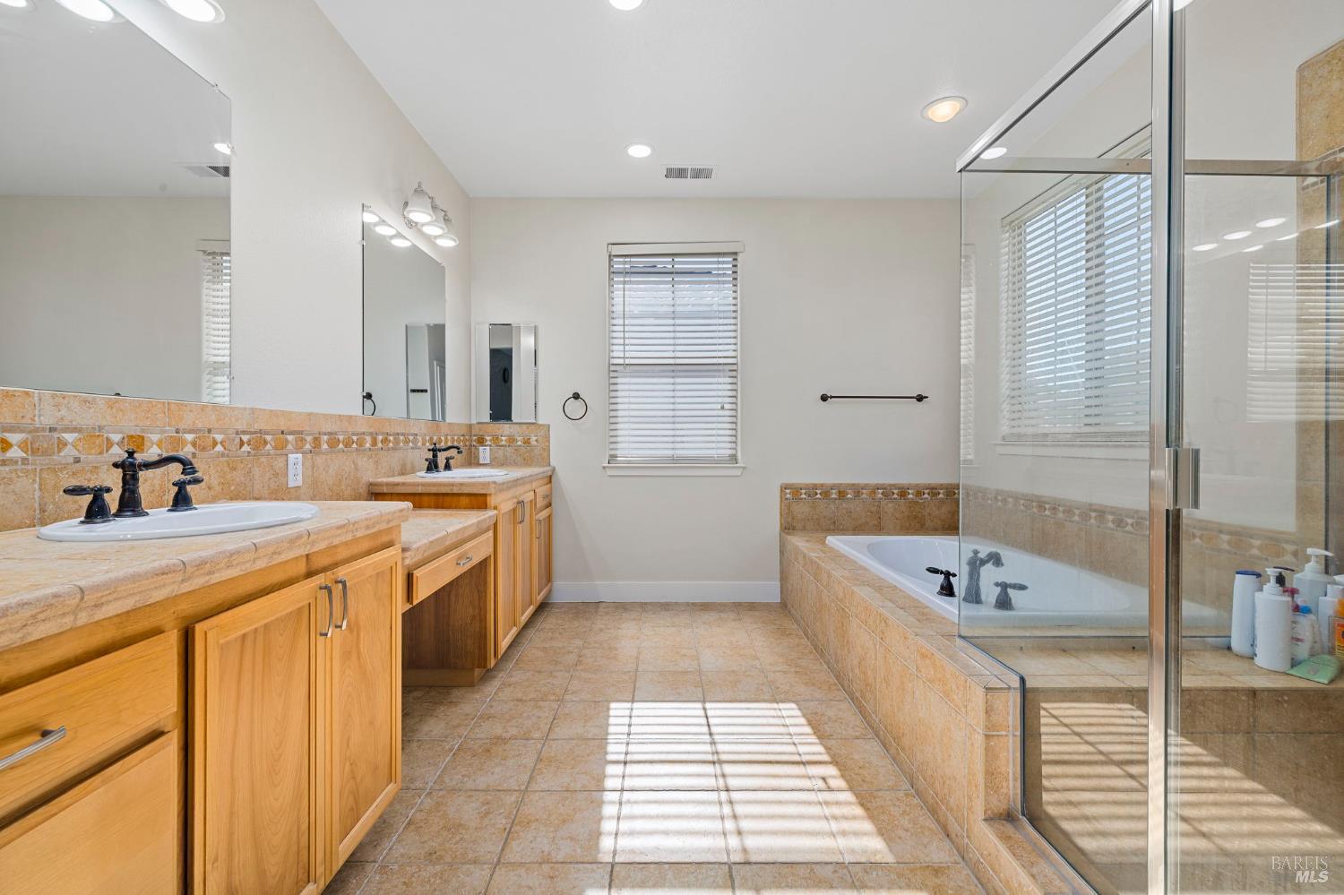 1461-1463 Trombetta Street Santa Rosa, CA 95407 - Photo 32 of 53 a large white bathroom with a tub sink and mirror