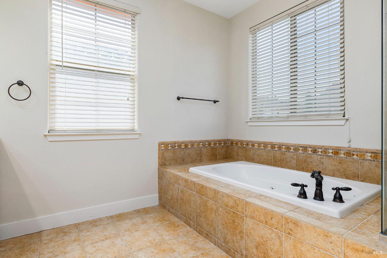1461-1463 Trombetta Street Santa Rosa, CA 95407 - Photo 34 of 53 a bathroom with a bathtub and a window