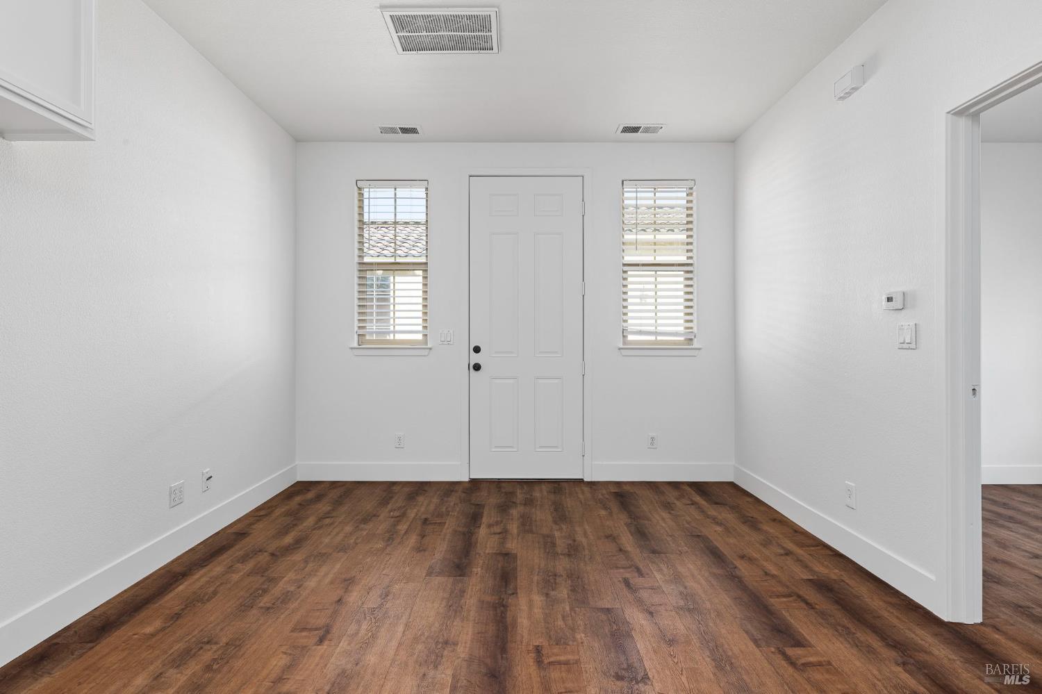 1461-1463 Trombetta Street Santa Rosa, CA 95407 - Photo 37 of 53 an empty room with wooden floor and windows