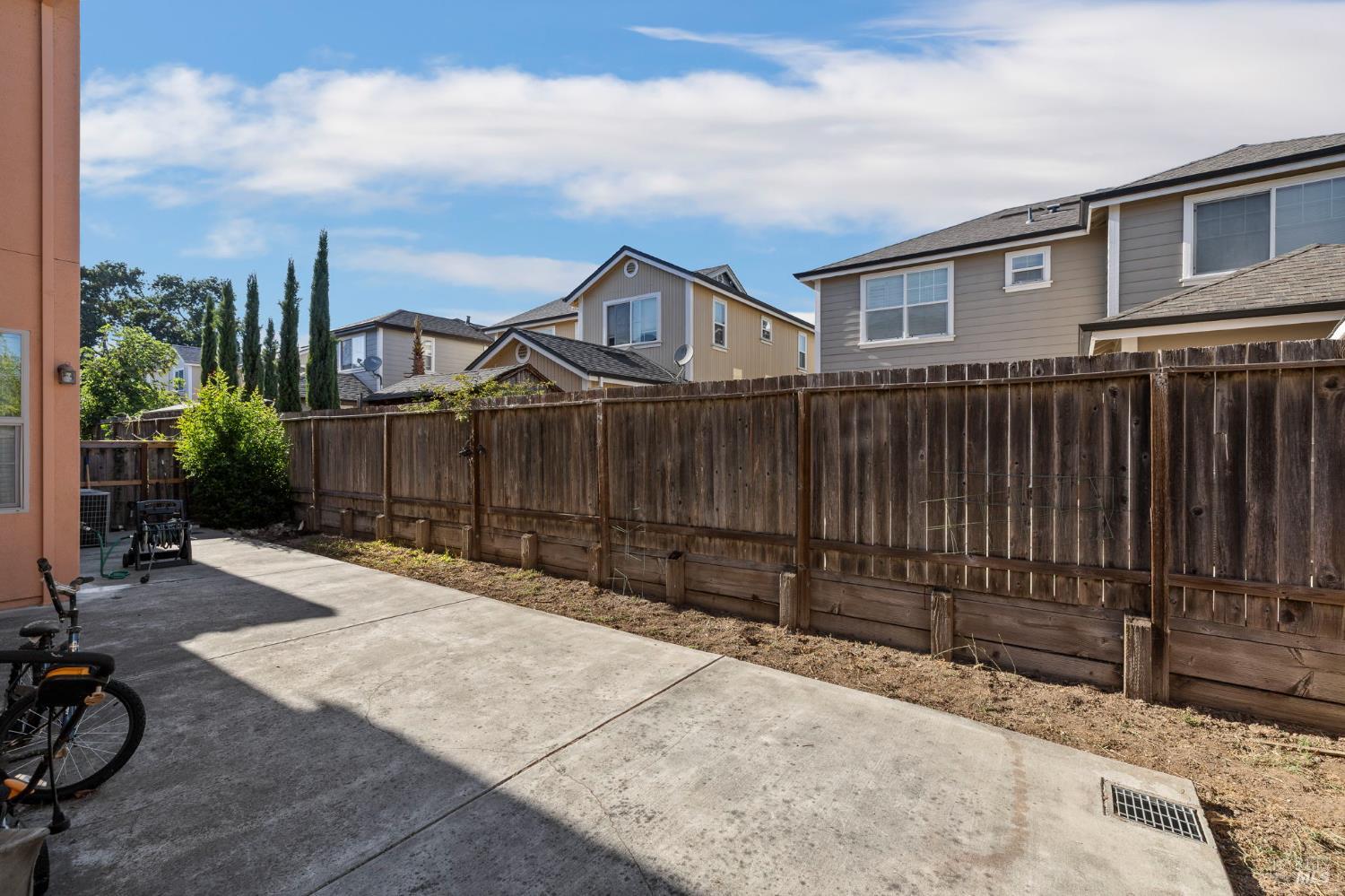 1461-1463 Trombetta Street Santa Rosa, CA 95407 - Photo 44 of 53 a backyard of a house with wooden fence