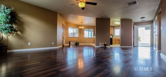 705 Ginger Avenue Ridgecrest, CA 93555 - Photo 3 of 21 a view of a room with wooden floor