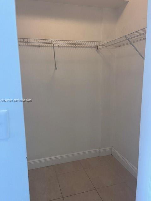 11060 Southwest 196th Street, Unit 313 Cutler Bay, FL 33157 - Photo 12 of 18 a view of small space with racks on the wall