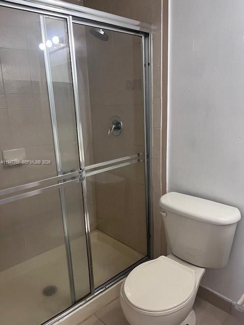 11060 Southwest 196th Street, Unit 313 Cutler Bay, FL 33157 - Photo 13 of 18 a white toilet sitting next to a shower