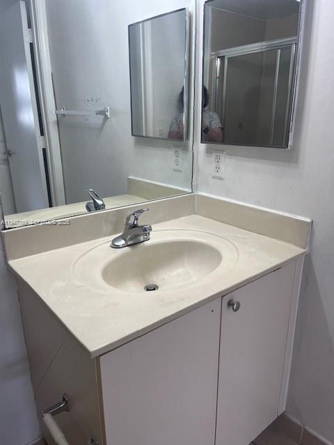 11060 Southwest 196th Street, Unit 313 Cutler Bay, FL 33157 - Photo 14 of 18 a bathroom with a sink and a mirror
