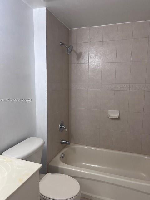 11060 Southwest 196th Street, Unit 313 Cutler Bay, FL 33157 - Photo 7 of 18 a bathroom with a toilet and a tub
