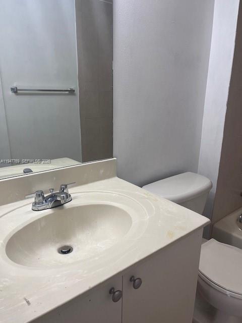 11060 Southwest 196th Street, Unit 313 Cutler Bay, FL 33157 - Photo 8 of 18 a bathroom with a sink and a toilet