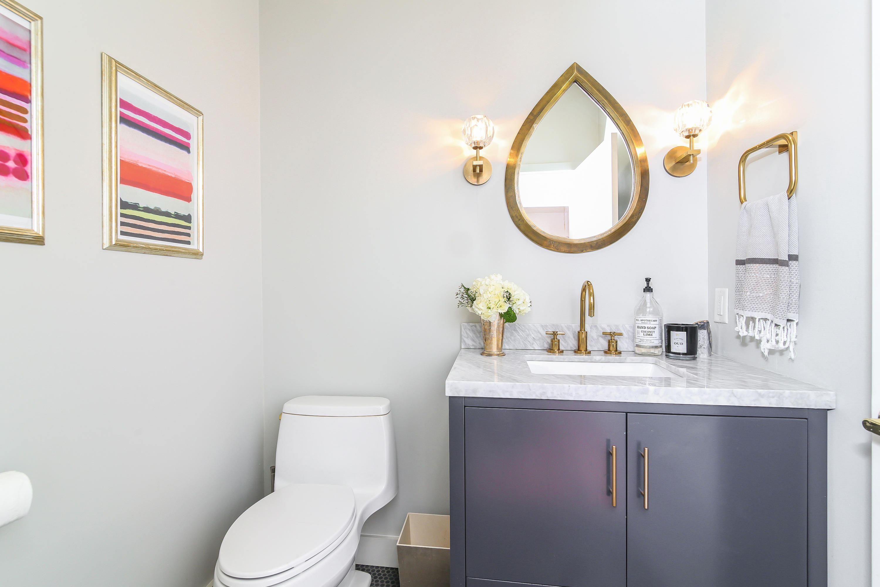 15 Marshall Ridge Road New Canaan, CT 06840 - Photo 21 of 30 a bathroom with a toilet sink vanity and mirror